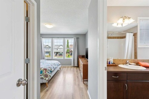 147 Sunset Cove, Cochrane, AB - Indoor Photo Showing Bedroom