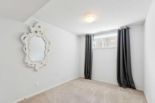 147 Sunset Cove, Cochrane, AB - Indoor Photo Showing Other Room