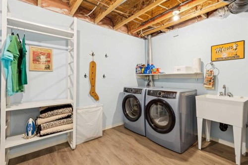 147 Sunset Cove, Cochrane, AB - Indoor Photo Showing Laundry Room