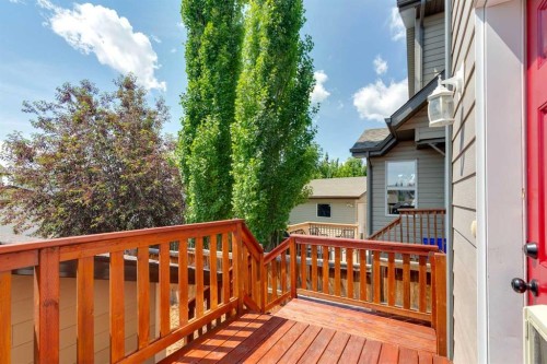 147 Sunset Cove, Cochrane, AB - Outdoor With Deck Patio Veranda With Exterior
