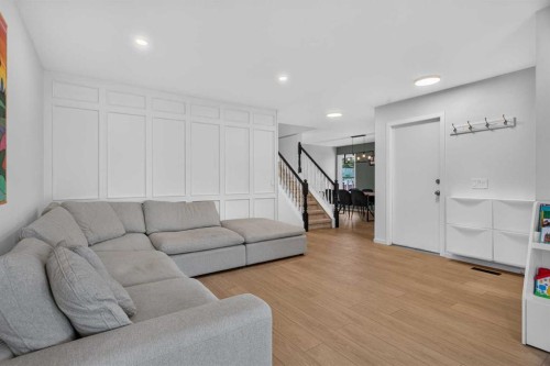 51 Millbank Court Sw, Calgary, AB - Indoor Photo Showing Living Room