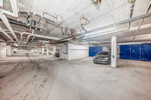 113-201 Sunset Drive, Cochrane, AB - Indoor Photo Showing Garage