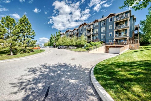 113-201 Sunset Drive, Cochrane, AB - Outdoor With Facade
