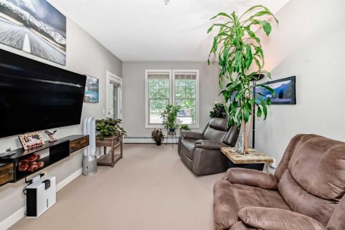 113-201 Sunset Drive, Cochrane, AB - Indoor Photo Showing Living Room