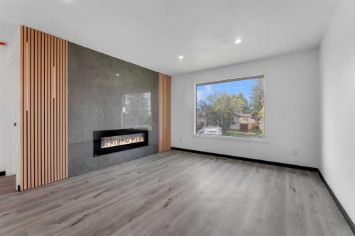 4108 13 Avenue Ne, Calgary, AB - Indoor Photo Showing Living Room With Fireplace
