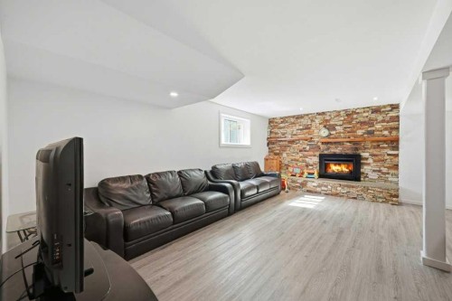 2415 Vista Crescent Ne, Calgary, AB - Indoor Photo Showing Living Room With Fireplace