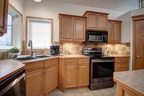 49 Thornfield Close Se, Airdrie, AB - Indoor Photo Showing Kitchen With Double Sink