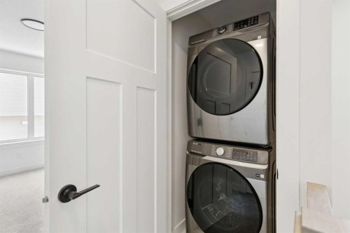 93 Heritage Park, Cochrane, AB - Indoor Photo Showing Laundry Room