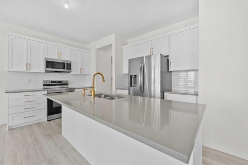 40 Carringham Gate Nw, Calgary, AB - Indoor Photo Showing Kitchen With Stainless Steel Kitchen With Double Sink With Upgraded Kitchen
