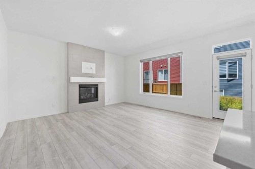 40 Carringham Gate Nw, Calgary, AB - Indoor Photo Showing Living Room With Fireplace