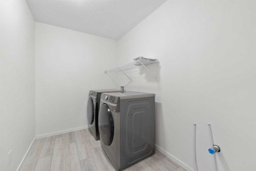 40 Carringham Gate Nw, Calgary, AB - Indoor Photo Showing Laundry Room