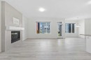 40 Carringham Gate Nw, Calgary, AB  - Indoor Photo Showing Living Room With Fireplace 