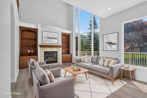 78 Hamptons Circle Nw, Calgary, AB - Indoor Photo Showing Living Room With Fireplace