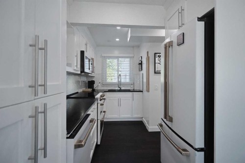 205-310 Falconridge Crescent Ne, Calgary, AB - Indoor Photo Showing Kitchen