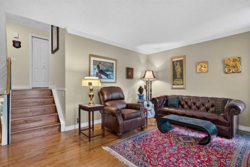 12-140 Point Drive Nw, Calgary, AB - Indoor Photo Showing Living Room