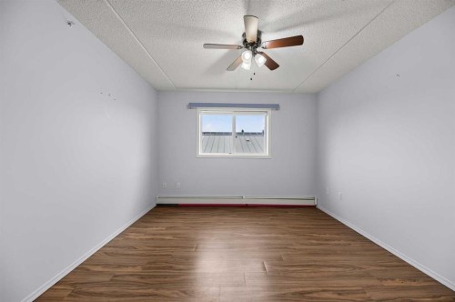 210-4514 54 Avenue, Olds, AB - Indoor Photo Showing Other Room