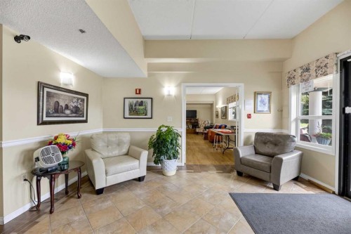 210-4514 54 Avenue, Olds, AB - Indoor Photo Showing Living Room
