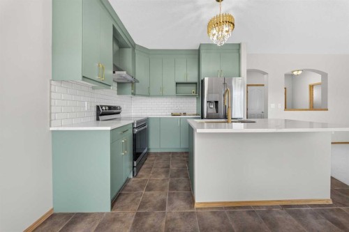 744 Luxstone Landing Sw, Airdrie, AB - Indoor Photo Showing Kitchen With Upgraded Kitchen
