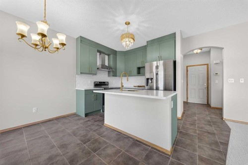744 Luxstone Landing Sw, Airdrie, AB - Indoor Photo Showing Kitchen With Upgraded Kitchen