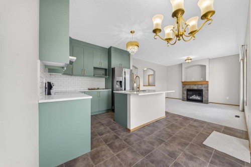 744 Luxstone Landing Sw, Airdrie, AB - Indoor Photo Showing Kitchen With Upgraded Kitchen