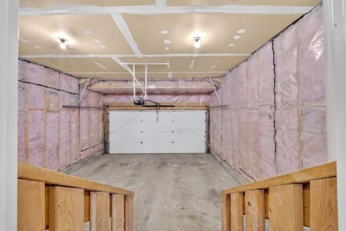 744 Luxstone Landing Sw, Airdrie, AB - Indoor Photo Showing Garage