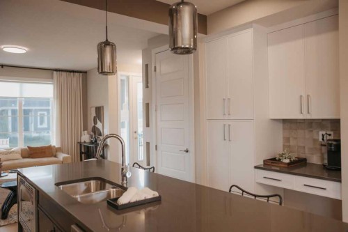 282 Southbow Avenue, Cochrane, AB - Indoor Photo Showing Kitchen With Double Sink