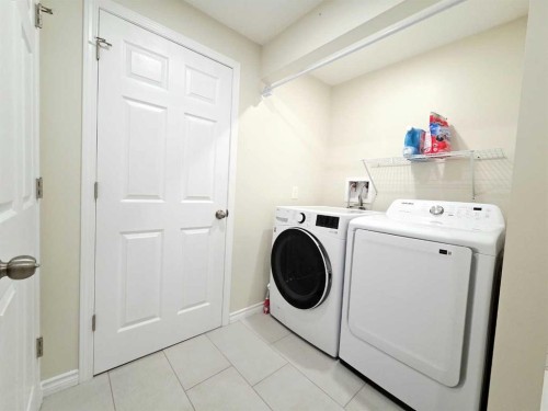 48 Covepark Place Ne, Calgary, AB - Indoor Photo Showing Laundry Room