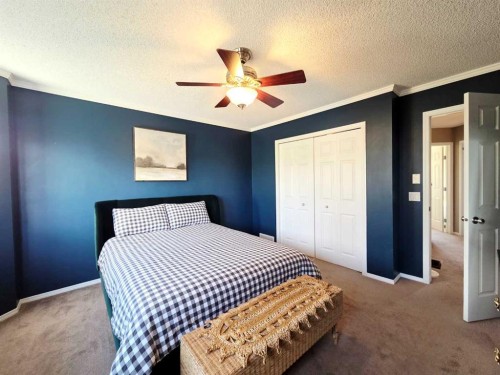 48 Covepark Place Ne, Calgary, AB - Indoor Photo Showing Bedroom