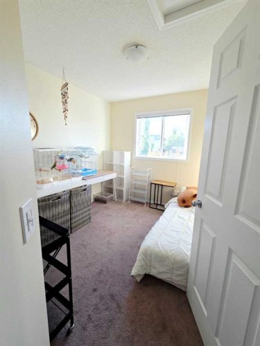 48 Covepark Place Ne, Calgary, AB - Indoor Photo Showing Bedroom