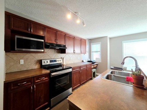 48 Covepark Place Ne, Calgary, AB - Indoor Photo Showing Kitchen With Double Sink