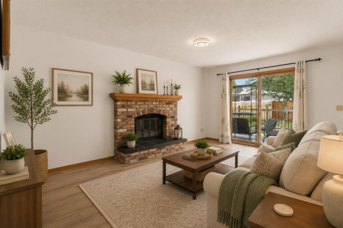 132 Scenic Cove Circle Nw, Calgary, AB - Indoor Photo Showing Living Room With Fireplace