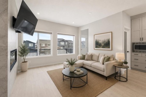 22 Edith Manor Nw, Calgary, AB - Indoor Photo Showing Living Room