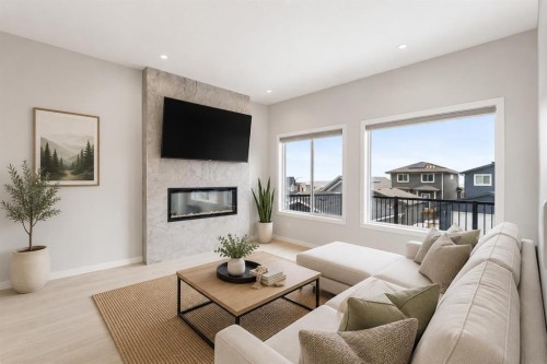 22 Edith Manor Nw, Calgary, AB - Indoor Photo Showing Living Room With Fireplace