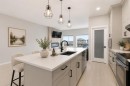 22 Edith Manor Nw, Calgary, AB  - Indoor Photo Showing Kitchen With Double Sink With Upgraded Kitchen 