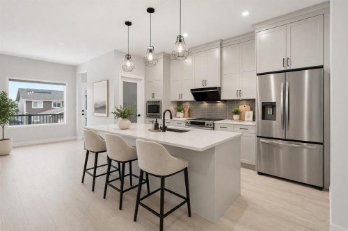 22 Edith Manor Nw, Calgary, AB - Indoor Photo Showing Kitchen With Upgraded Kitchen