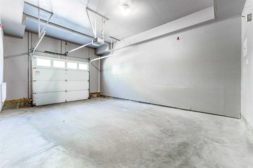 349-130 New Brighton Way Se, Calgary, AB - Indoor Photo Showing Garage