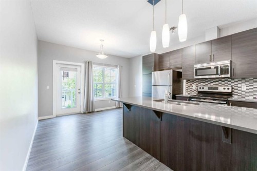 349-130 New Brighton Way Se, Calgary, AB - Indoor Photo Showing Kitchen With Upgraded Kitchen