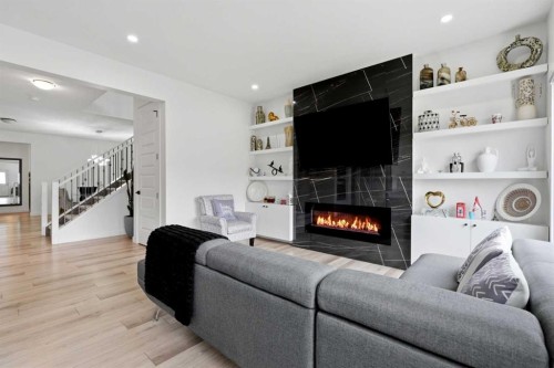 160 Homestead Grove Ne, Calgary, AB - Indoor Photo Showing Living Room With Fireplace