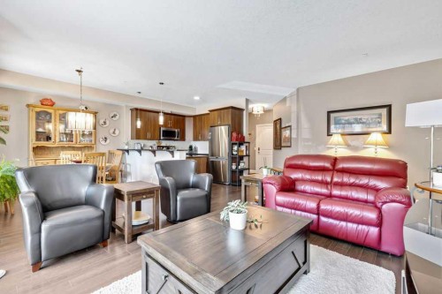 2110-15 Sunset Square, Cochrane, AB - Indoor Photo Showing Living Room