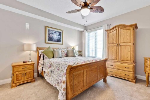 2110-15 Sunset Square, Cochrane, AB - Indoor Photo Showing Bedroom
