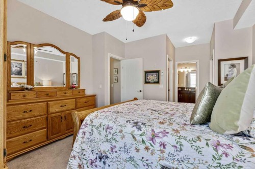 2110-15 Sunset Square, Cochrane, AB - Indoor Photo Showing Bedroom