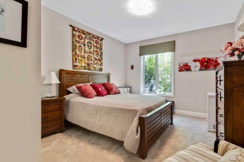2110-15 Sunset Square, Cochrane, AB - Indoor Photo Showing Bedroom