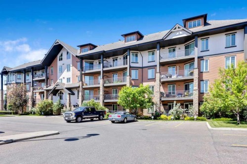 2110-15 Sunset Square, Cochrane, AB - Outdoor With Facade