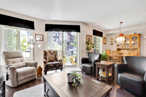 2110-15 Sunset Square, Cochrane, AB - Indoor Photo Showing Living Room