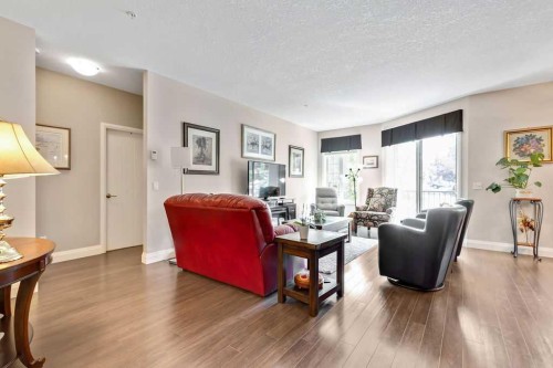 2110-15 Sunset Square, Cochrane, AB - Indoor Photo Showing Living Room