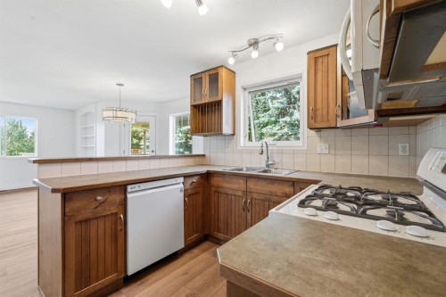 763 Stonehaven Drive, Carstairs, AB - Indoor Photo Showing Kitchen With Double Sink