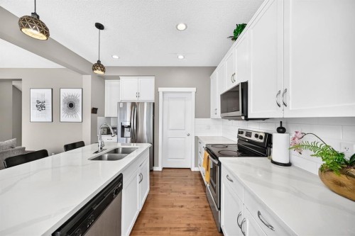 68 Sage Valley Drive Nw, Calgary, AB - Indoor Photo Showing Kitchen With Double Sink With Upgraded Kitchen
