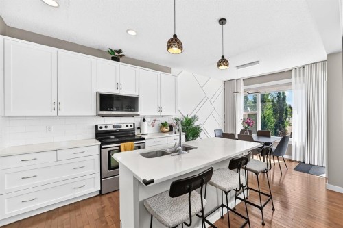 68 Sage Valley Drive Nw, Calgary, AB - Indoor Photo Showing Kitchen With Double Sink With Upgraded Kitchen