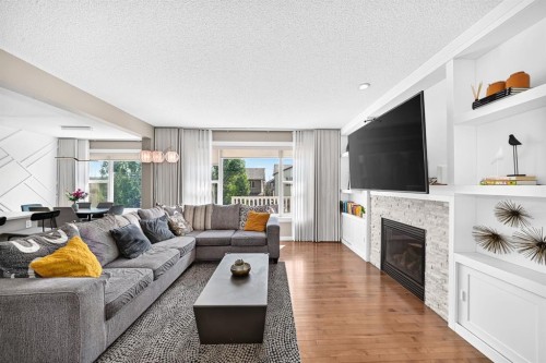 68 Sage Valley Drive Nw, Calgary, AB - Indoor Photo Showing Living Room With Fireplace