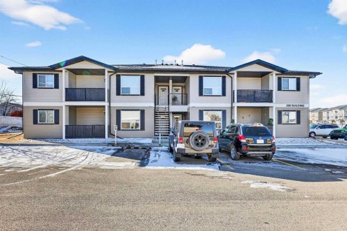 302-8 Bayside Place, Strathmore, AB - Outdoor With Facade